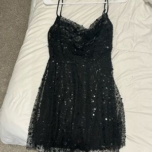 Lucy in the sky, black sparkle mini dress.